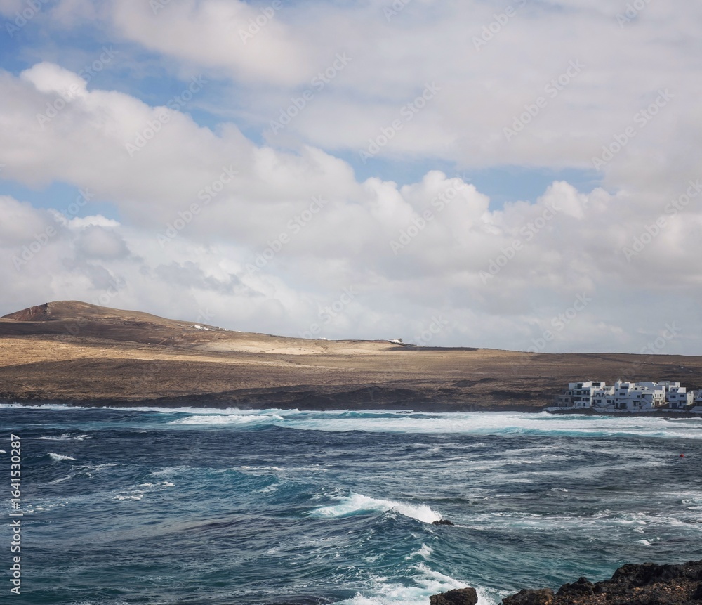 “Natural rugged beach landscape with powerful ocean waves in Lanzarote” “Natural rugged beach landscape with powerful ocean waves in Lanzarote”