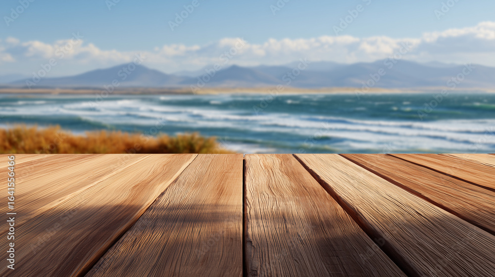 Fototapeta premium Smooth polished wooden planks neatly aligned with scenic ocean waves and distant mountain landscape under blue sky with soft clouds