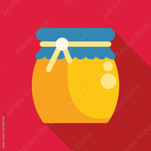 Closed honey jar with blue cap, decorated with a ribbon, isolated on red background