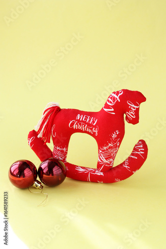 Horse, sewn by the hands of a craftswoman. Symbol of 2026. Red Fire Horse on a yellow background.
