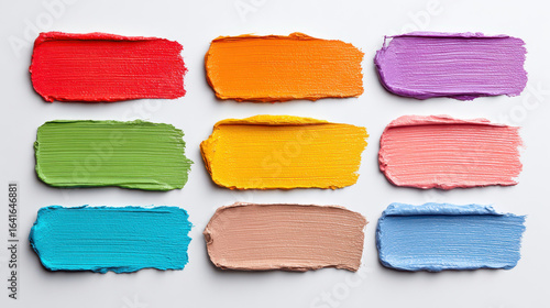 Vibrant color swatches with heavy paint texture in nine bright shades on white background