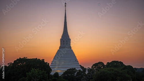 White pagoda illuminated at...