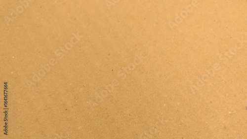 Background of brown kraft paper or cardboard texture. Brown recycled paper texture background.