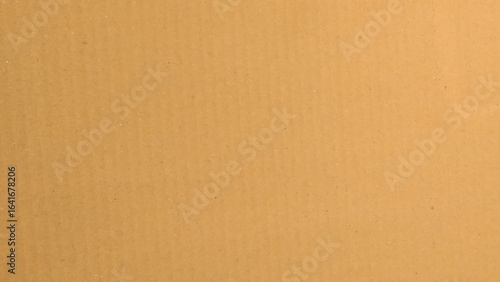 Background of brown kraft paper or cardboard texture. Brown recycled paper texture background.