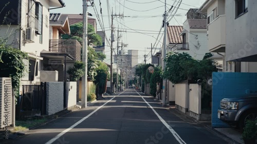 Peaceful urban street in Tokyo, no cars, warm light.
