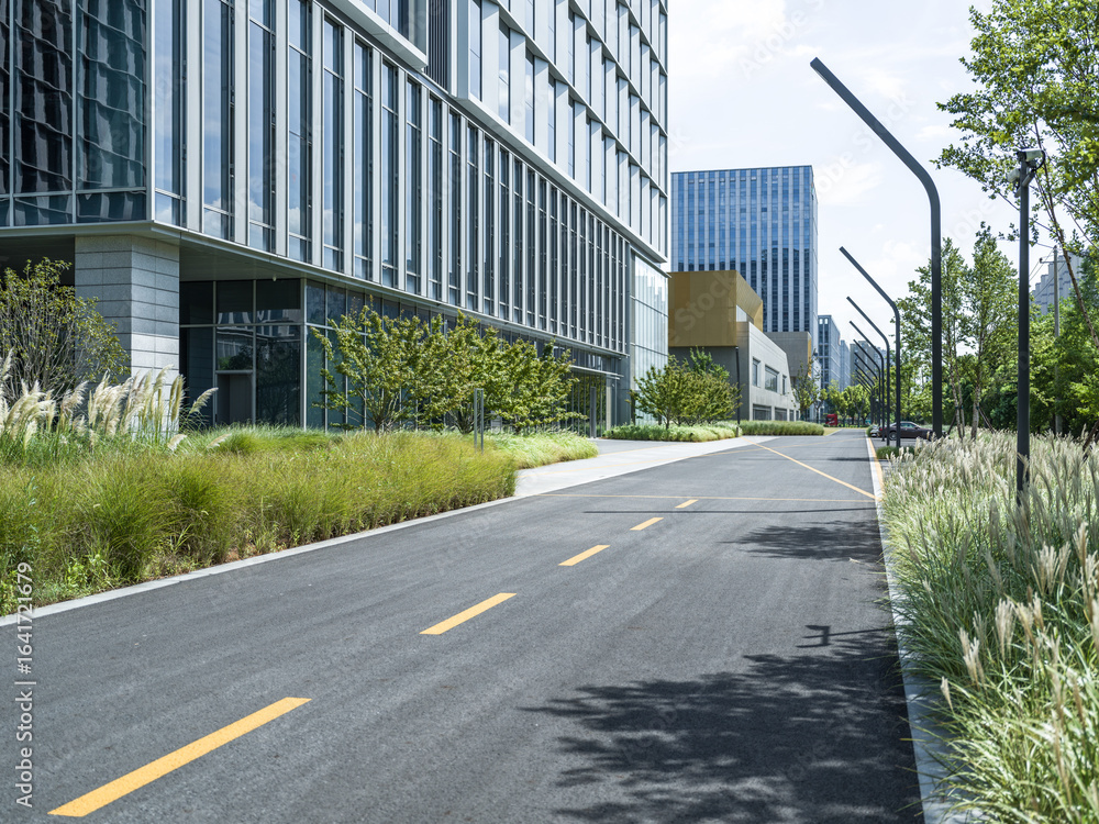 Fototapeta premium enpty asphalt road with modern office building