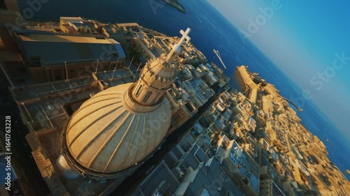 Church and dome. Valletta, capital of Maltese island. Sunset city. FPV drone view