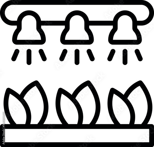 Seedlings growing under a grow lamp, symbolizing indoor gardening and plant cultivation