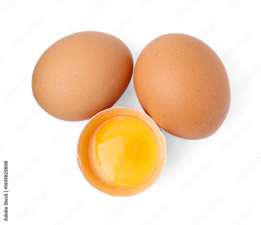 Whole and broken chicken eggs isolated on white, top view Whole and broken chicken eggs isolated on white, top view