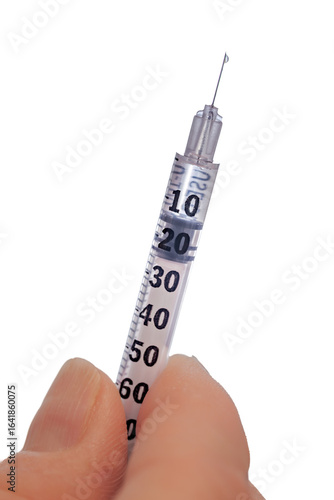 Patient holds syringe and prepares to inject glp-1 medication