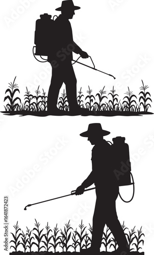 Farmer spraying crops in a field silhouette