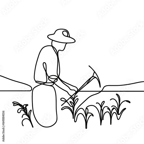 Farmer tilling field against landscape