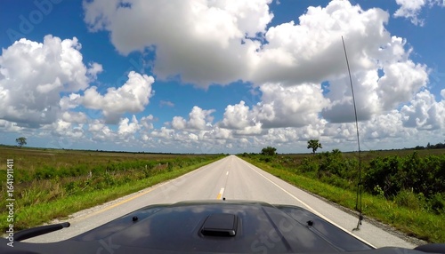 Open road, bright sky, and country views