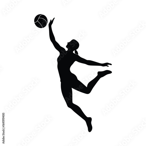 Silhouette of a female volleyball player spiking