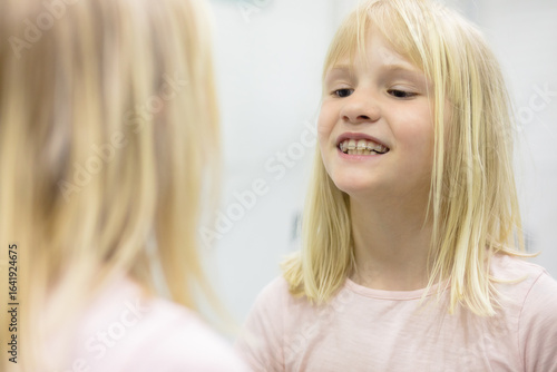 Blonde kid with dental plate