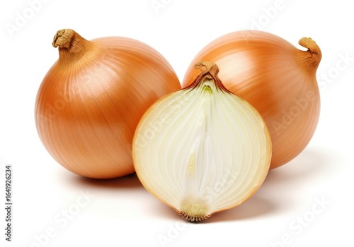 Three whole yellow onions and one halved onion studio shot food vegetable
