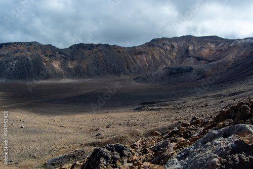 Vast Volcanic Crater Under Cloudy Sky