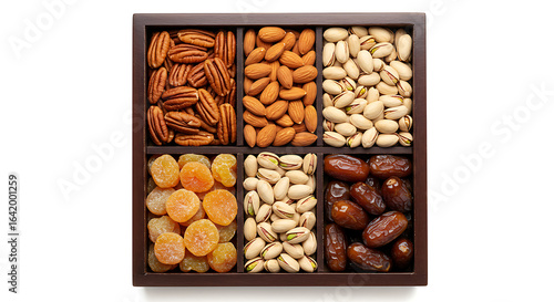 Fototapeta Naklejka Na Ścianę i Meble -  Assortment of nuts and dried fruits in a wooden box isolated on white background