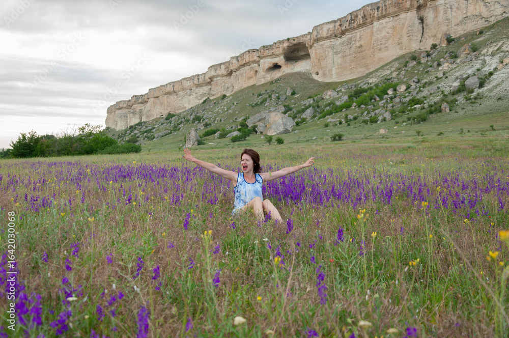 Obraz premium Photo session outdoors of a pretty girl in shorts, a shirt and a dress