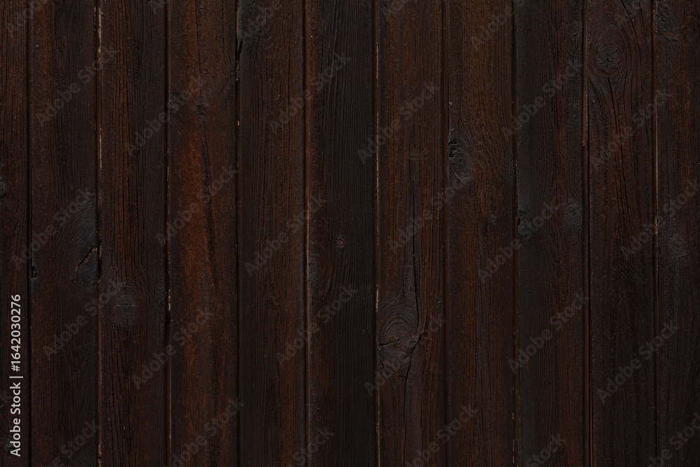 Naklejka premium Dark, rustic wood plank wall