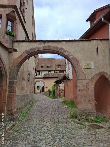 narrow street in the old town of Riquewihr, Alsace, France