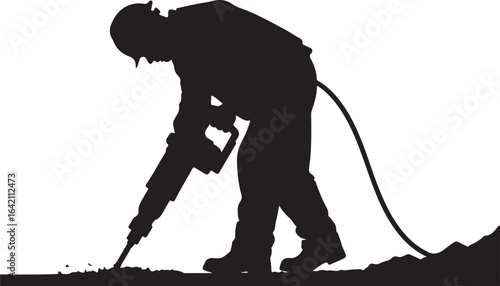 Worker jackhammering ground with pneumatic tool breaking ground construction