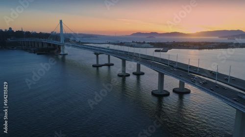 Wallpaper Mural Aerial view of the San Francisco-Oakland Bay Bridge at sunset, with cars commuting. The bridge connects San Francisco and Oakland, California, USA. Torontodigital.ca