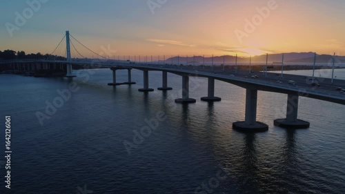 Wallpaper Mural Aerial view of the Bay Bridge, Oakland, California, USA, at sunrise. Cars travel across the bridge, connecting San Francisco to the East Bay. Torontodigital.ca