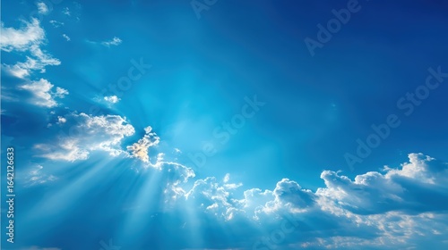 Skyward Gaze: Sunbeams Bursting Through Clouds in a Vibrant Blue Sky, Inspiring Hope and Serenity