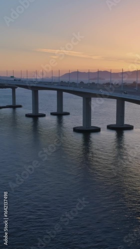 Wallpaper Mural Aerial view of the Bay Bridge, Oakland, California, USA, at sunrise. Cars travel across the bridge, connecting San Francisco to the East Bay. Torontodigital.ca