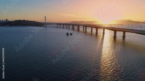 Wallpaper Mural Aerial view of the Bay Bridge, Oakland, California, USA, at sunrise. Cars travel across the bridge, connecting San Francisco to the East Bay. Torontodigital.ca