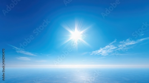 Vibrant Sunlight Illuminates a Tranquil Blue Sky and Water Horizon, Showcasing Peace and Serenity