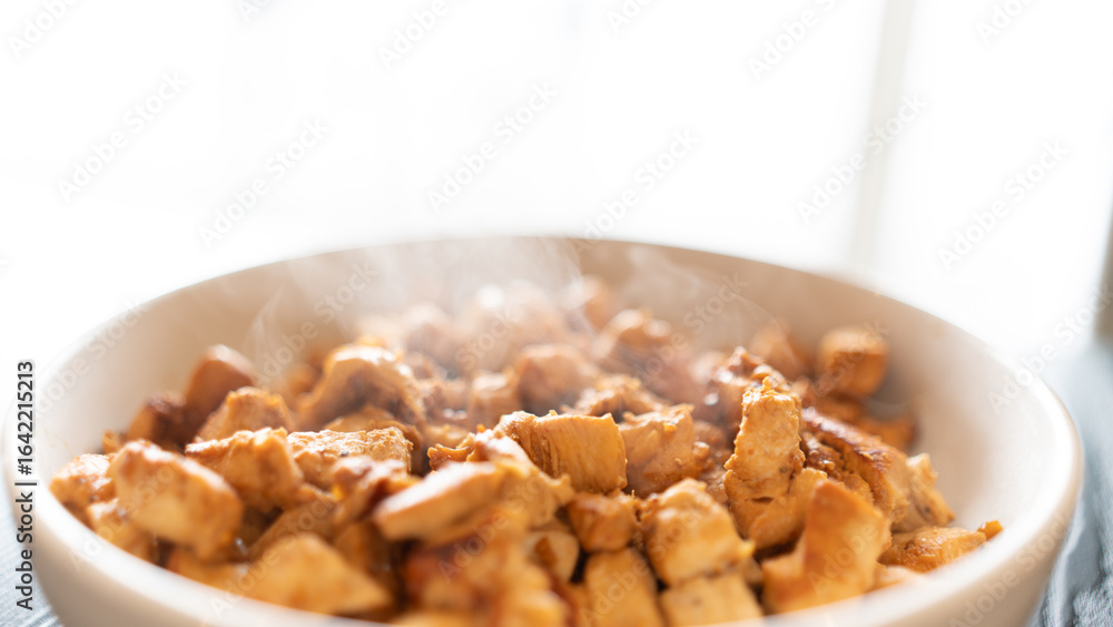 Juicy cubed chicken sautéed with garlic and minimal oil, steaming fresh. Healthy protein dish perfect for meal prep, fitness recipes, and food photography Juicy cubed chicken sautéed with garlic and minimal oil, steaming fresh. Healthy protein dish perfect for meal prep, fitness recipes, and food photography