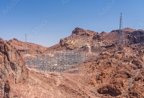 Collection of electricity pylons and transformers in canyon by the Hoover dam in Nevada