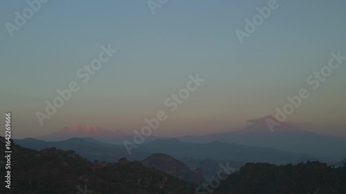 Aerial view of the Popocatépetl volcano in Mexico, seen from beautiful meadows. Mountains and volcanoes of Mexico, travel and vacation concept, 4k nature.
