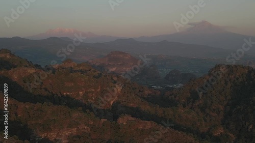 Aerial view of the Popocatépetl volcano in Mexico, seen from beautiful meadows. Mountains and volcanoes of Mexico, travel and vacation concept, 4k nature.
