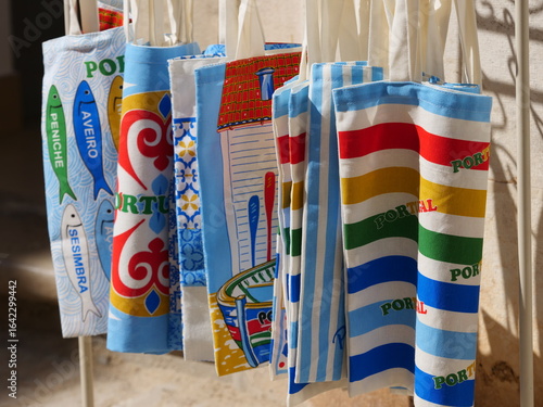 Tableau sur toile Souvenir bags or pouches typically sold in Portugal, featuring various Portugues