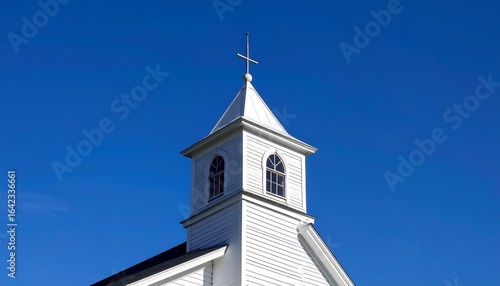 White church steeple against clear sky