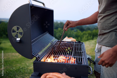 Man prepares a barbecue
