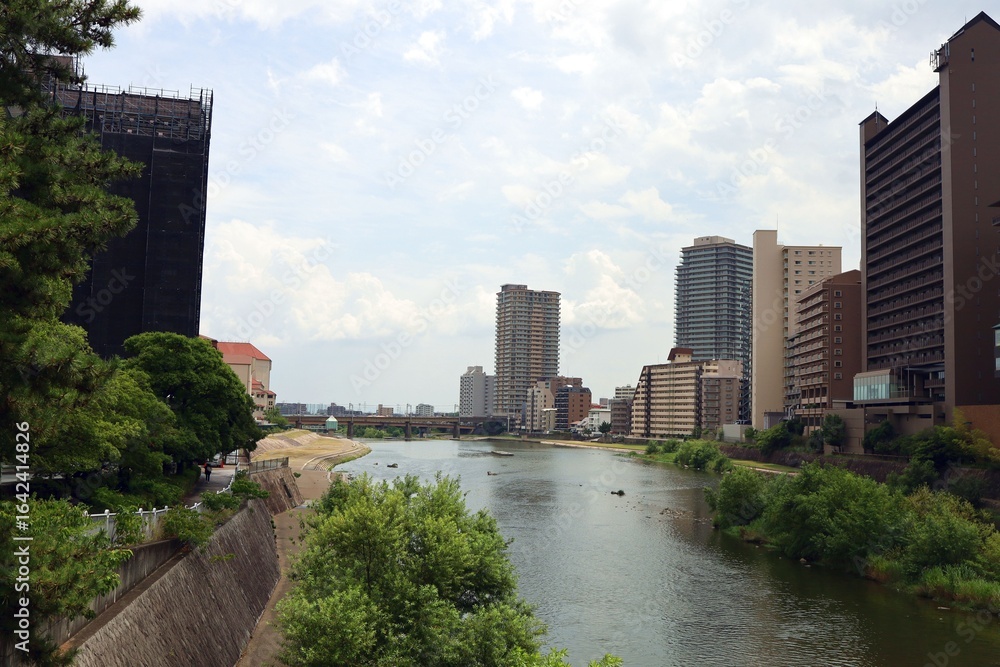 Fototapeta premium August 8, 2025, Takarazuka City, Hyogo Prefecture, Japan. Scenery around the Muko River.