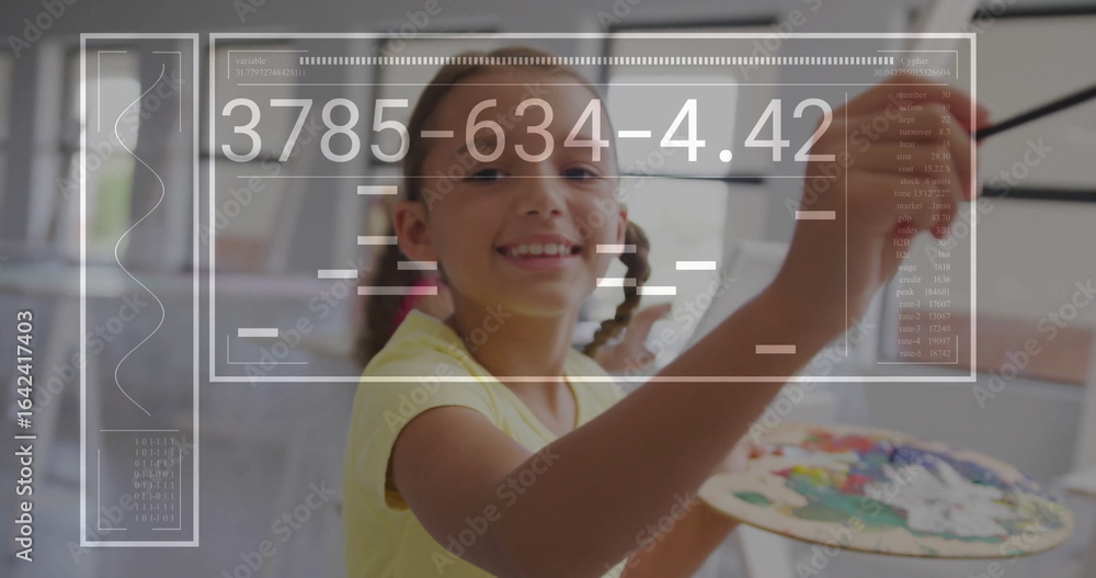 Obraz premium Painting girl in yellow shirt applying paint to canvas on easel in studio, with paintbrush palette