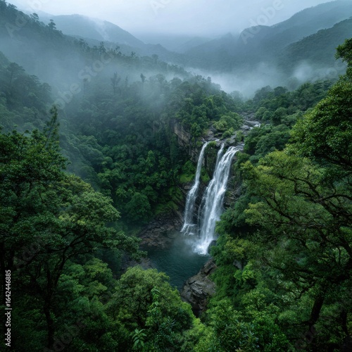 A thundering waterfall cascading into a misty, tranquil pool.