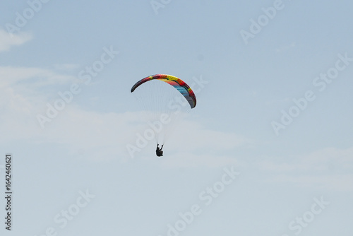 Wallpaper Mural Man paragliding in the town of Organya in the province of Lleida in northern Spain in August 2025. Torontodigital.ca