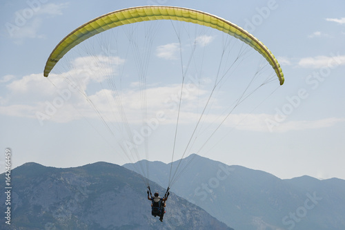 Man paragliding in the town of Organya in the province of Lleida in northern Spain in August 2025.