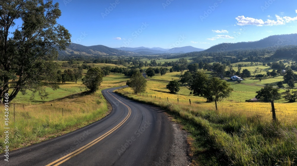 Fototapeta premium Country road through scenic valley