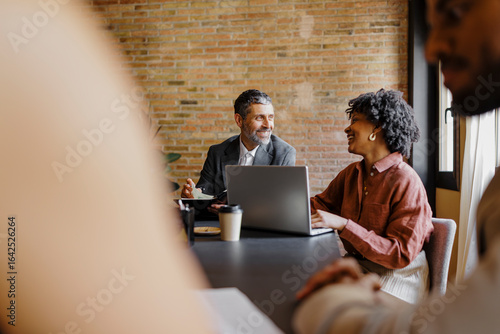 Lawyers working together on a laptop in the office