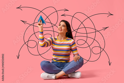 Young woman with paper plan...