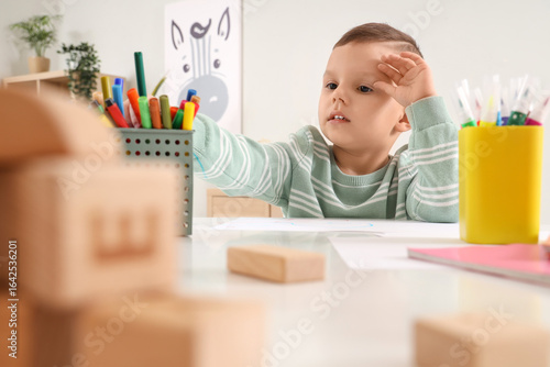 Funny little boy drawing wi...