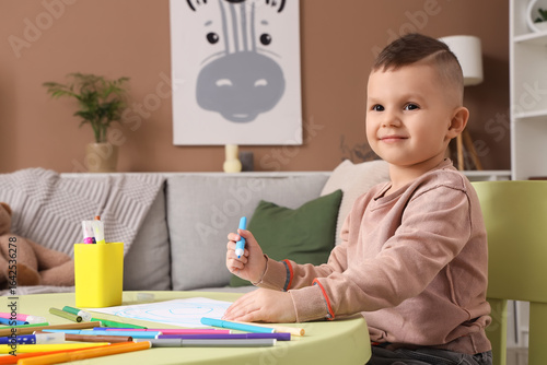 Funny little boy drawing wi...