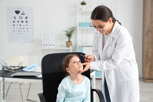 Female ophthalmologist with...
